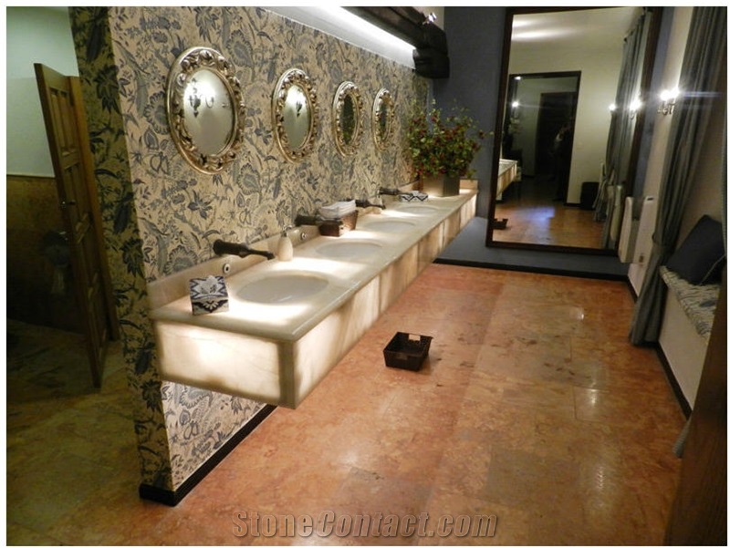 Baja Onyx Bathroomm Countertop and Ticul Naranja Limestone Flooring