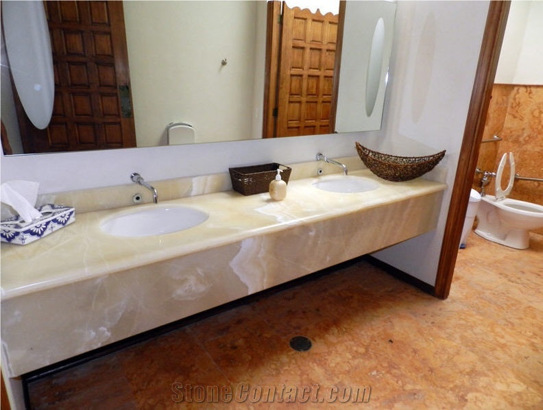 Baja Onyx Bathroomm Countertop and Ticul Naranja Limestone Flooring