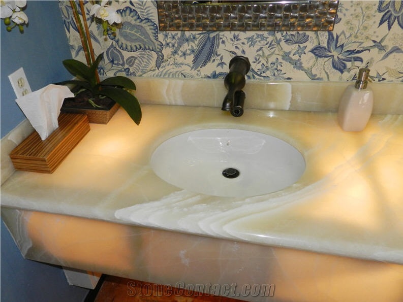 Baja Onyx Bathroomm Countertop and Ticul Naranja Limestone Flooring