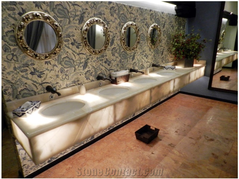 Baja Onyx Bathroomm Countertop and Ticul Naranja Limestone Flooring