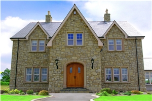 Donegal Sandstone with Brush Hammered Sandstone Window and Door Surrounds