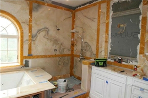 Peach & Apache Gold Onyx Bathroom Design