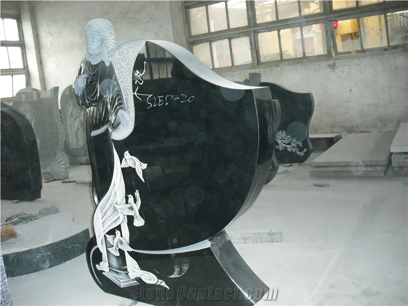 Dark Green Granite Headstone with Jesus Carving