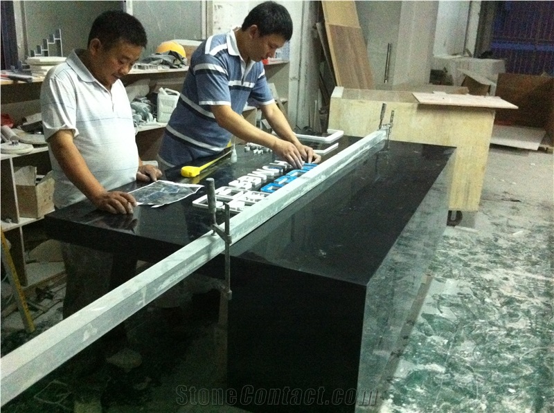 black artificial stone reception desk modern design, solid surface tabletops