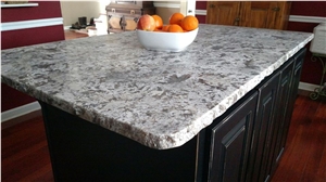 Island in Bianco Antico Granite Honed Finish with a Rock Edge Detail