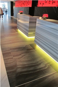 Copper Dune Quartzite Wall and Marmara Equator Marble Reception Desk Top
