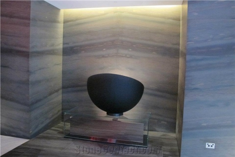 Copper Dune Quartzite Wall and Marmara Equator Marble Reception Desk Top