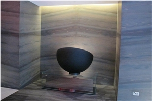 Copper Dune Quartzite Wall and Marmara Equator Marble Reception Desk Top