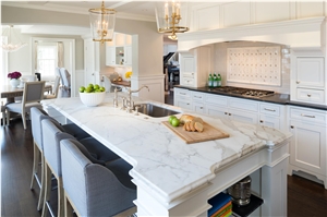 Calcutta Gold Honed with an Ogee Edge Kitchen Island Top, Via Lactea Honed Perimeter Countertop