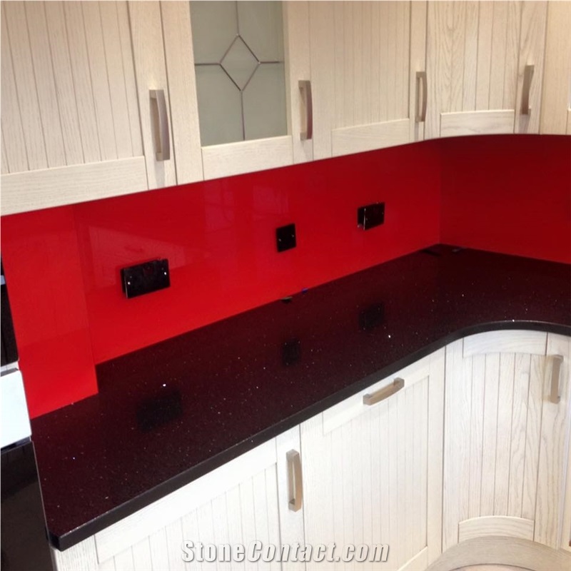 Red Glass Splashback on Black Sparkling Quartz Countertop