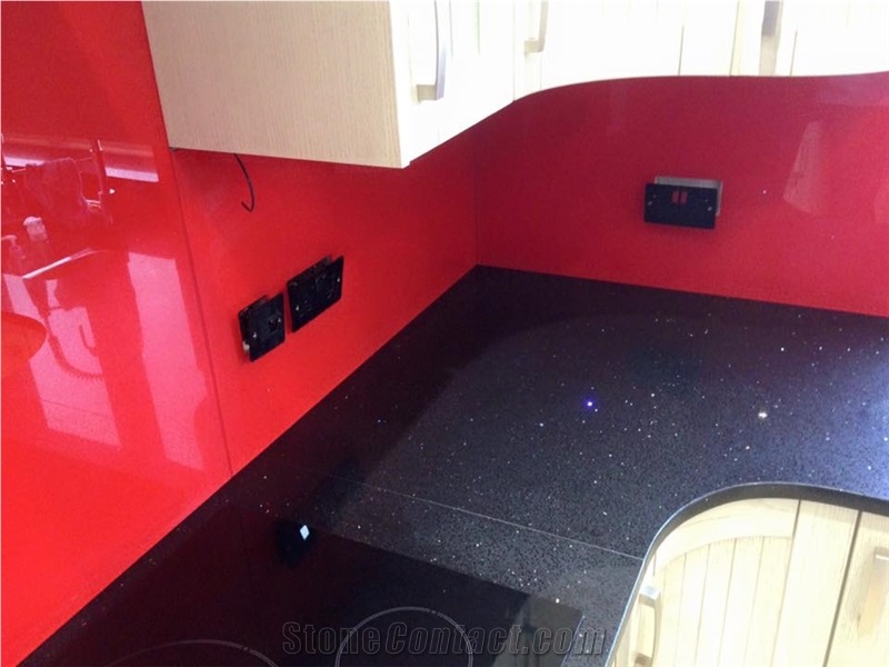 Red Glass Splashback on Black Sparkling Quartz Countertop