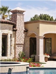 Traditional Raised Panel Columns with Brick Chimney and Decorative Sloped Chimney Cap, Pinon Rio Blanco Cantera Building Stone