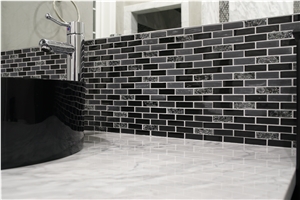 Bathroom Accent Wall Using Super White Quartzite to Tie the Countertops and Room Together