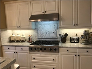 Marble Counters and Honed Carrara Subway Backsplash