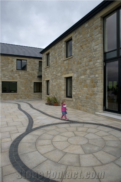 Gold Granite Circle with Black Limestone Paving