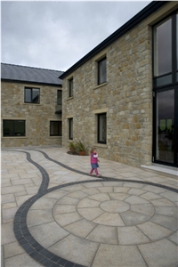 Gold Granite Circle with Black Limestone Paving