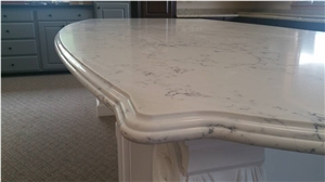 Carrara White Quartz by Aggranite with the Ogee Bull Edge Table Top