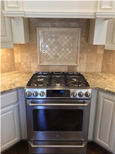 Granite Countertop, Beautiful Travertine Backsplash with Decorative Mural over Cooktop!