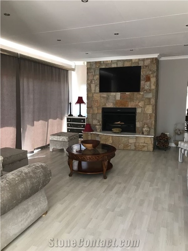Sandstone Masonry Traditional Fireplace with White Marble Hearth