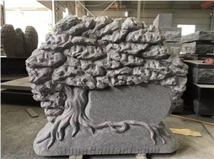 Grey Moument With Tree Carving To USA