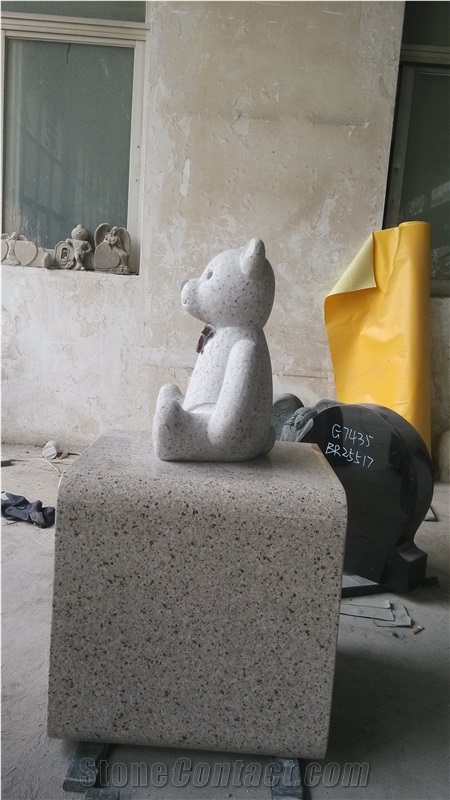 Yellow Beige Monument with Bear Carving