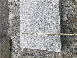 G603 New Grey Granite Picked Cleft Kerbstone