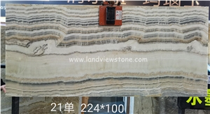 Light through Beige Wooden Veins Onyx Slab