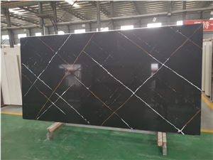 Black with White Lines Quartz Slab Behind Range