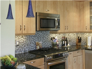 Volga Blue Granite Countertops with Glass Mosaic Backsplash