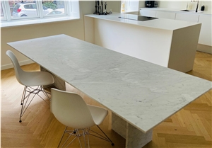 Dining table in Carrara white marble