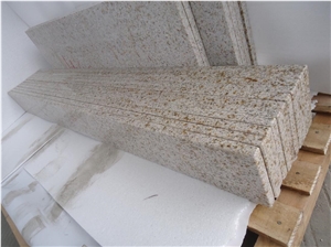 Rusty Yellow Granite Countertop And Backsplash 