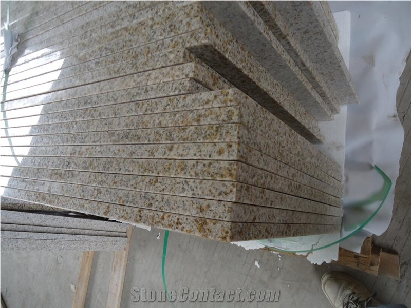 Rusty Yellow Granite Countertop And Backsplash 