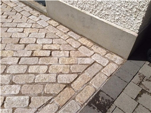 Gold Granite Circle With Black Granite Cobble Stone Patio