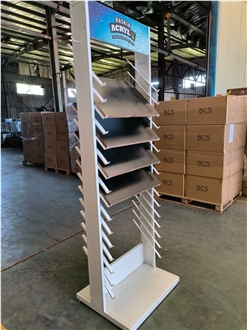 Multi-Layered Metal Display Rack With Tilted Shelves