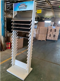 Multi-Layered Metal Display Rack With Tilted Shelves