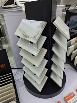Rotating Multi-Layered Display Rack With Tilted Shelves